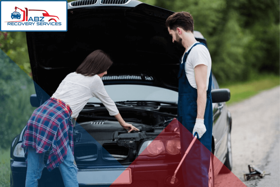 ABZ Recovery Services - Car Recovery Birmingham - Recovery worker giving roadside assistance to a car